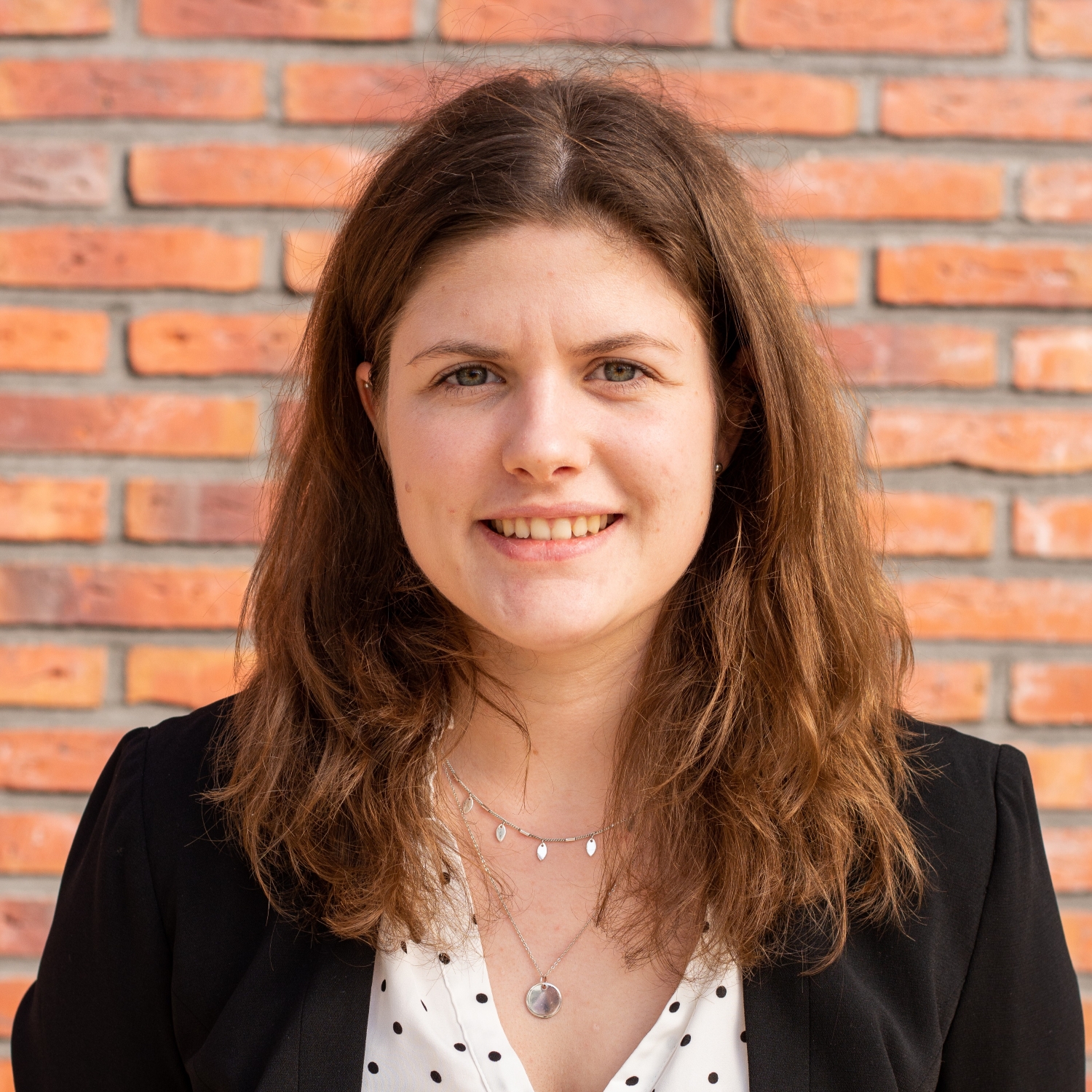 A professional headshot of a businesswoman.